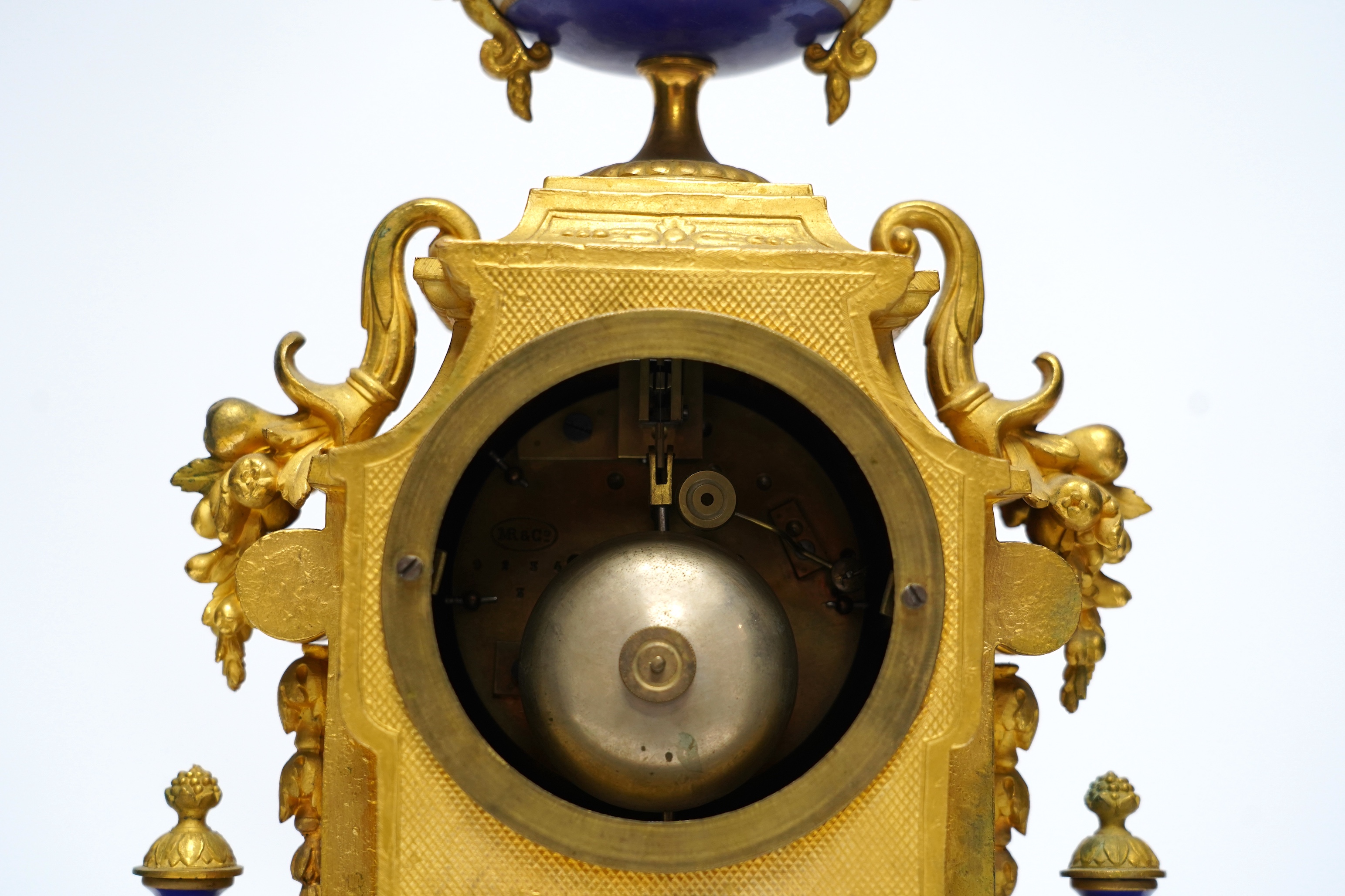 A late 19th century French ormolu mantel clock, MR and Co. Ernest Viroy, with key and pendulum, 39cm